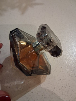 La Nuit Tresor 30 ml perfume, missing a small amount