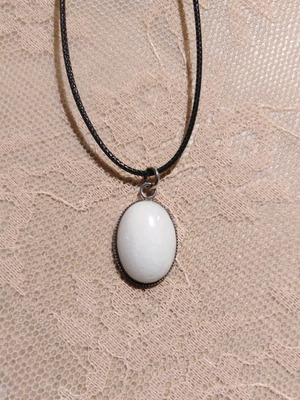 Handmade pendant with white nephrite and steel cabochon