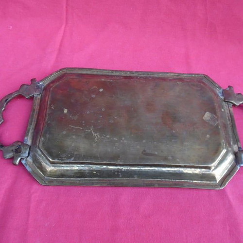 Handmade brass tray used with carved handles