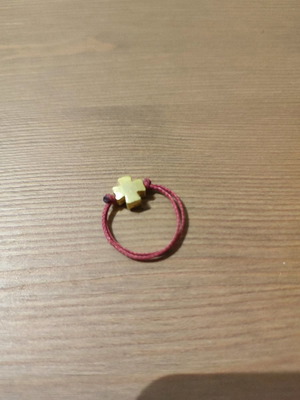 Handmade ring with cross used, gold tone and burgundy cord