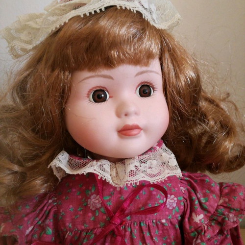 Porcelain doll used, 38cm tall with clothes and shoes
