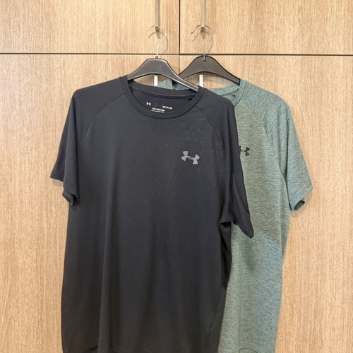 Under Armour sports shirts used, sizes Small and Medium, black and turquoise