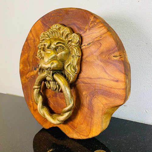 Bronze door knocker used with lion head and wooden base