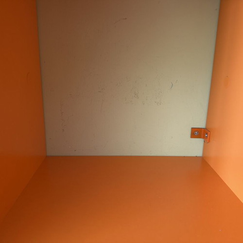 Modern orange wall shelf unit for kids or office