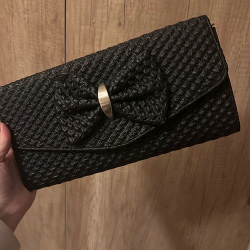 Black clutch bag with bow and gold chain like new