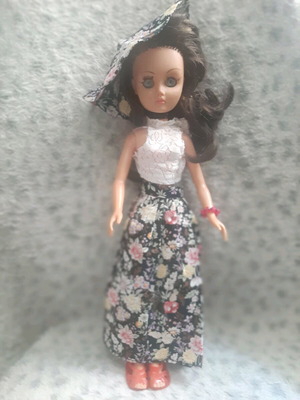 Bella doll mannequin used, rare dark-haired collectible with clothes