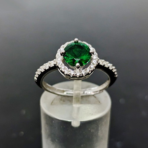Silver rosetta ring new, adjustable with green zircon