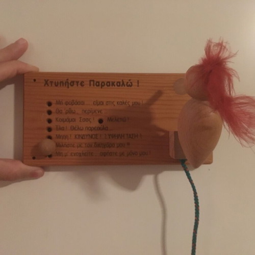 Wooden decorative children's door sign used with woodpecker