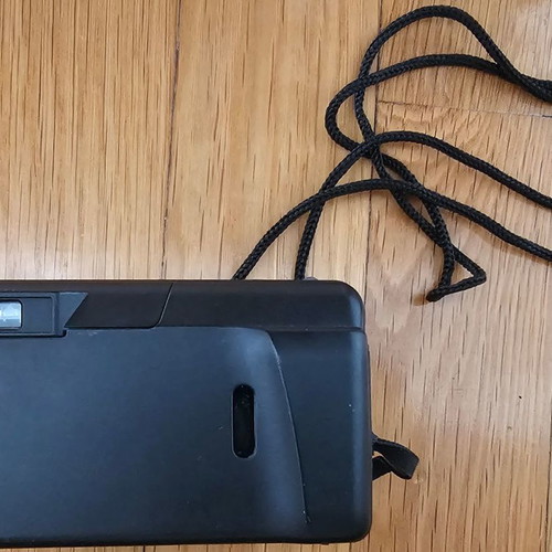 Olympus Superzoom 70G camera used with case