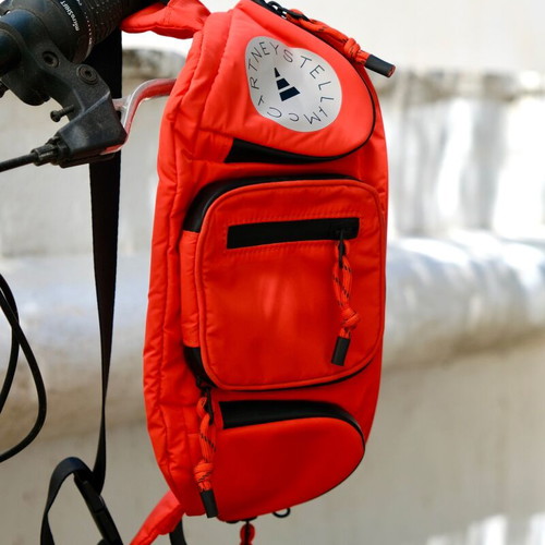 Adidas Stella McCartney large waterproof waist bag, black and orange
