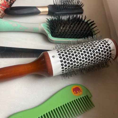 Collection of used combs and brushes