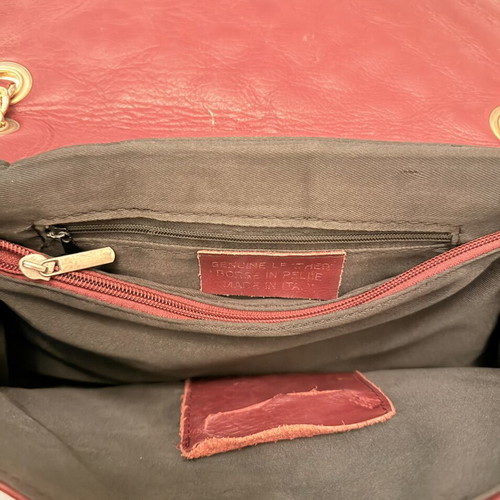 Italian leather shoulder bag used with wear on corners and chain