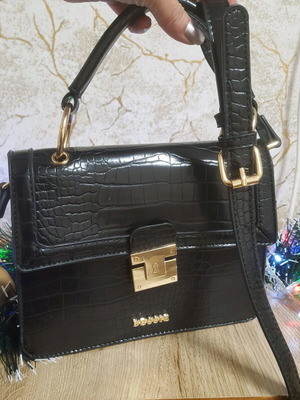 Bessie London shoulder bag like new with animal texture, black and gold