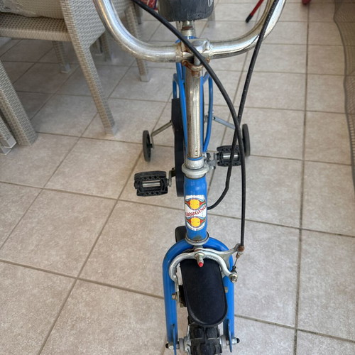 Vintage children's bike used, blue with training wheels for ages 5-7