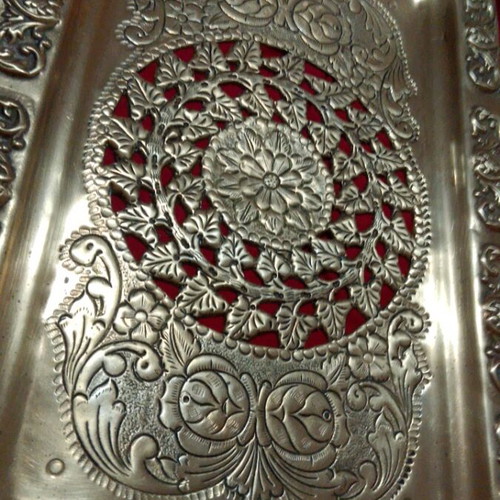 Vintage brass serving tray with embossed handles and angel motifs like new