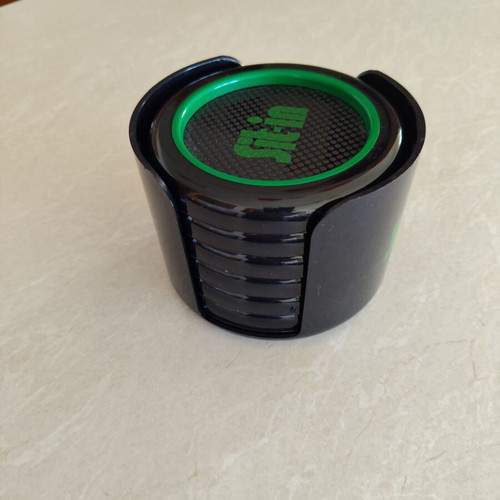 Coaster set of six plastic pieces with holder, like new