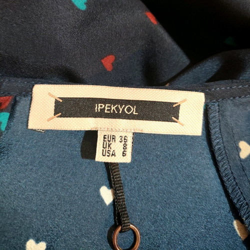 Office pants and top with hearts used, yellow and blue