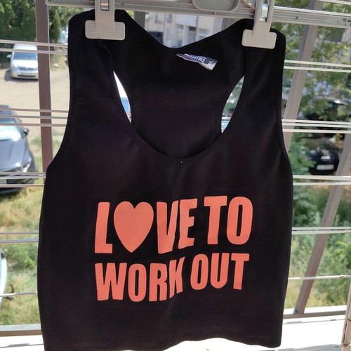 Sports top like new, black and orange, elastic fabric