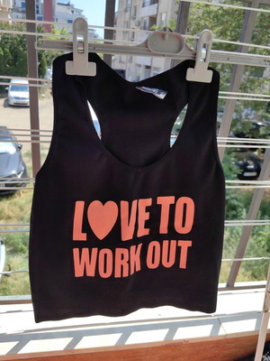 Sports top like new, black and orange, elastic fabric