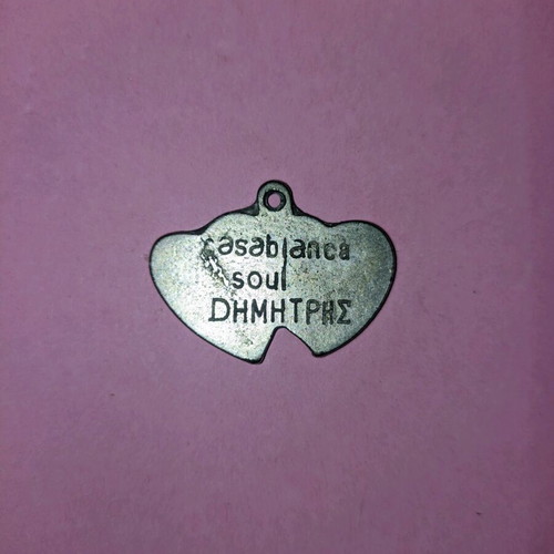 Metal heart-shaped pendant like new