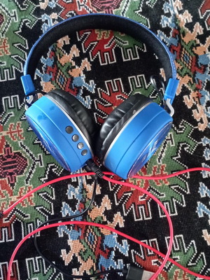 Wireless and wired headphones used with wear on the leatherette