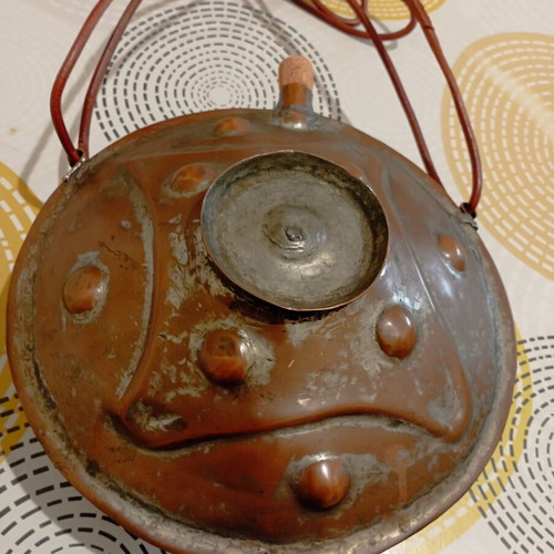 Traditional copper flask used with leather strap