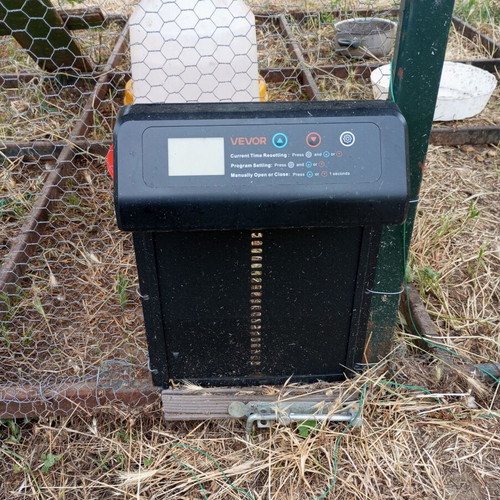 Mobile chicken coop used with automatic timer door