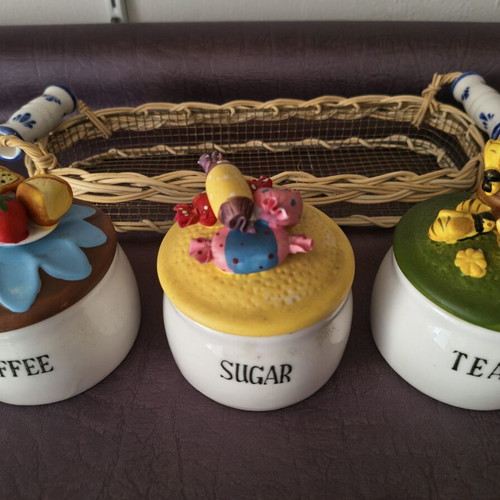 Set of 3 ceramic kitchen jars with handmade lids and wicker basket