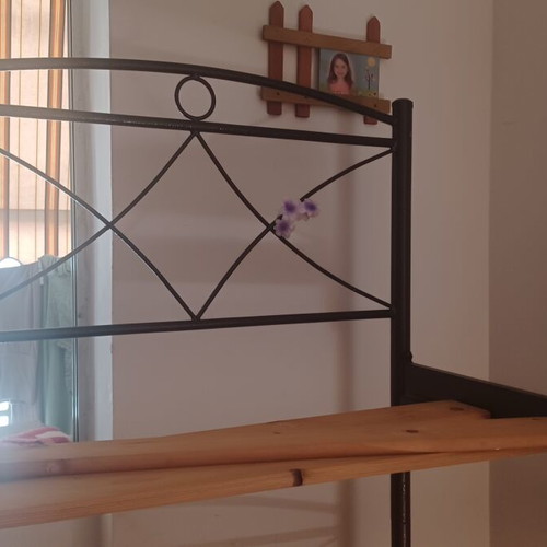 Metal bunk beds with ladder and slats