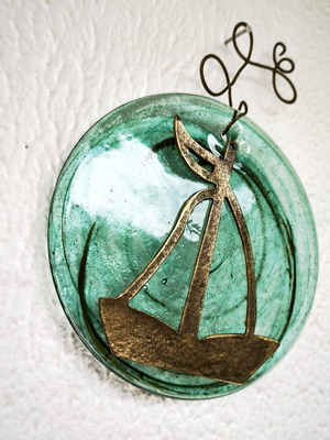Glass and bronze wall decoration with sailboat