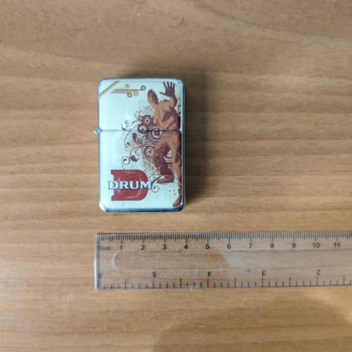 Drum promotional lighter used, functional, collectible