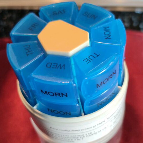 Rotating plastic weekly pill organizer new medication storage device