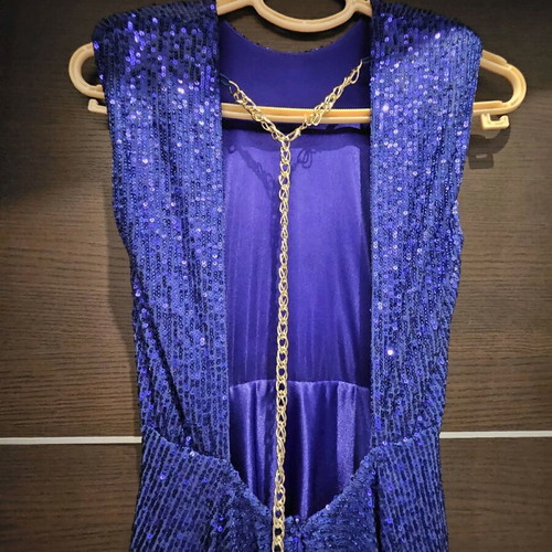 Diamond blue dress like new, open back with shoulder pads