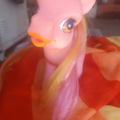 Large pink pony toy with colorful mane and tail