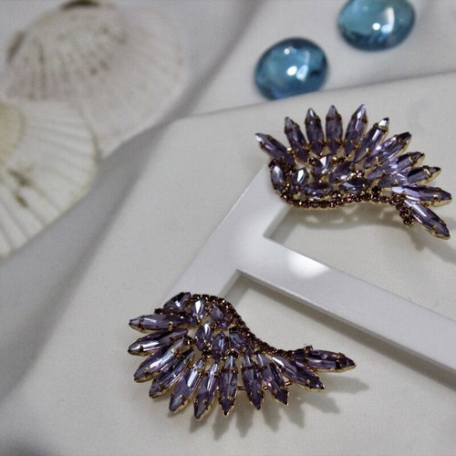 Earrings with purple stones angel wing design like new