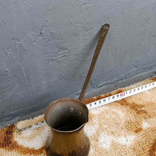 Old cezve handmade with engraved handle, used