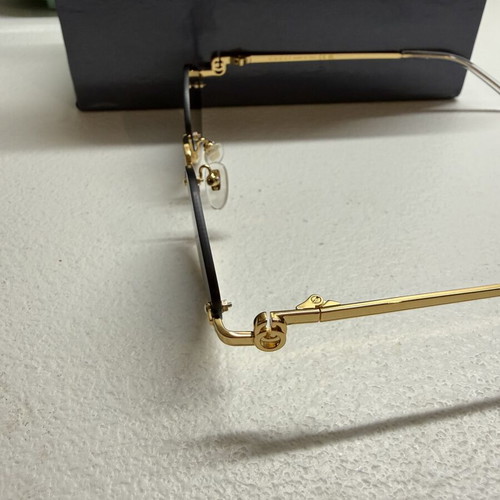 Gucci GG1604S 001 sunglasses, gold frame with black lenses
