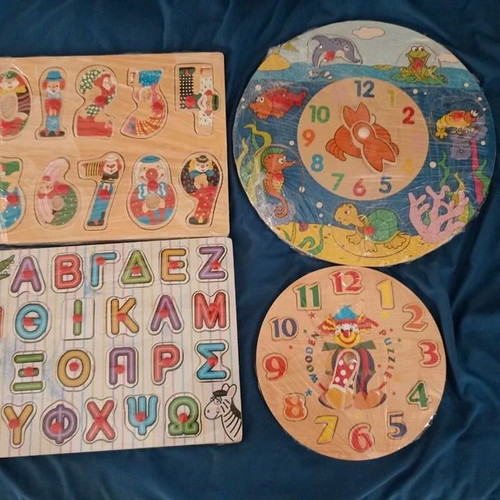 Wooden puzzle toys used, set of 4 with letters, numbers, and sea figures