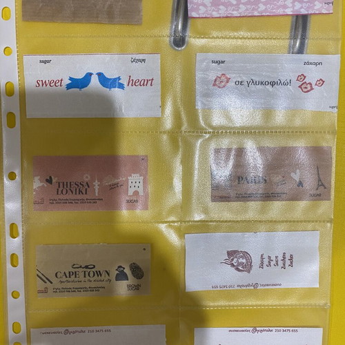 Sugar packet collection, 69 in holders plus 5 loose