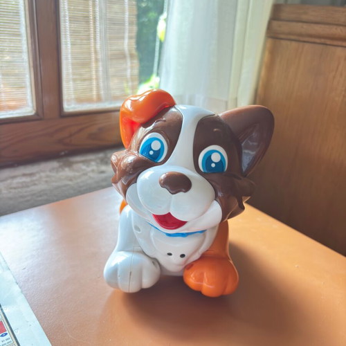 Colorful puppy toy on wheels designed by Clementini