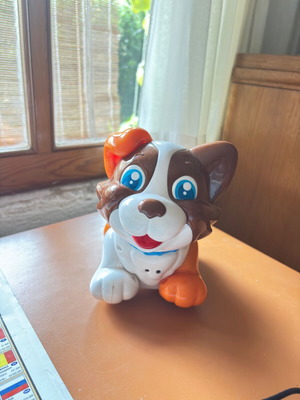 Colorful puppy toy on wheels designed by Clementini