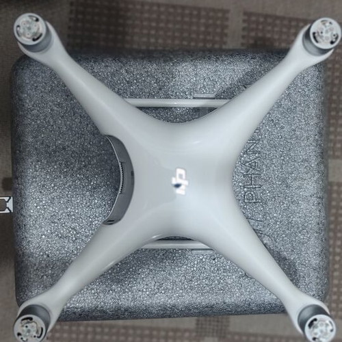 DJI Phantom 4 drone with accessories (no working batteries)