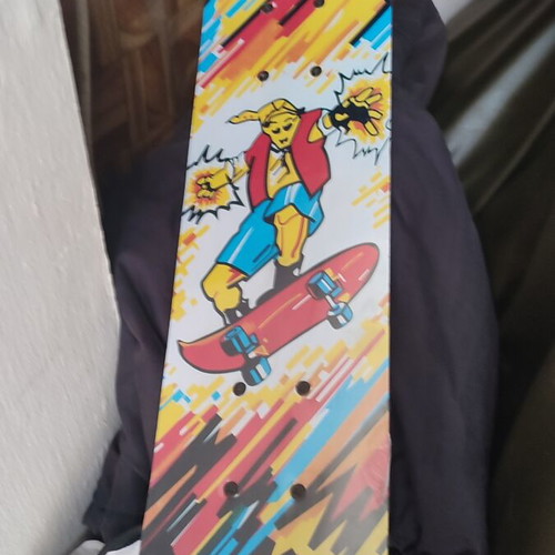 Children's skateboard with colorful comic design, sealed