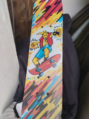Children's skateboard with colorful comic design, sealed