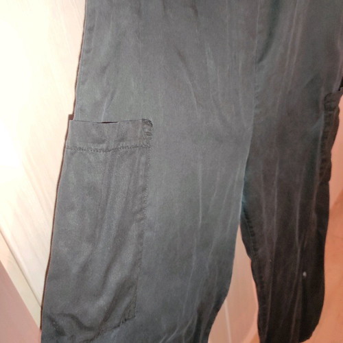 One-piece jumpsuit used, black with side pockets