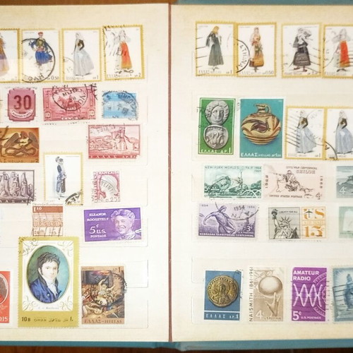 Book with collection of various Greek and foreign stamps used