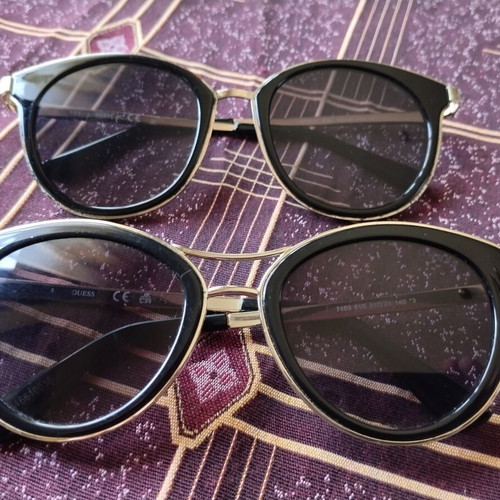 Guess women's sunglasses set used, black and gold, pack of 2