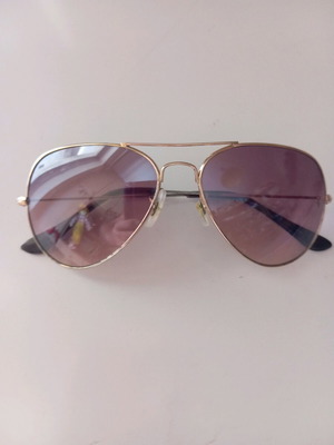 Unisex sunglasses used with minor scratch