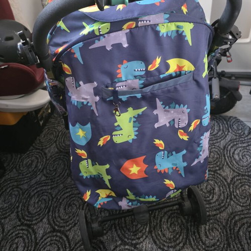 Cossato Dinosaur baby stroller used with rain cover
