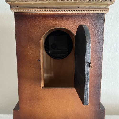 Vintage tabletop clock used with leather finish and brass carved details